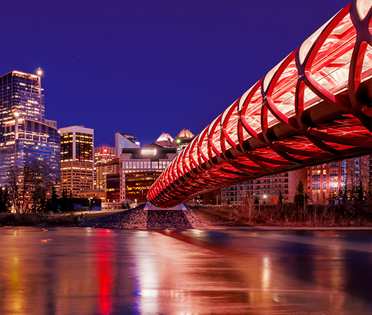 Bridge over water leading to a city