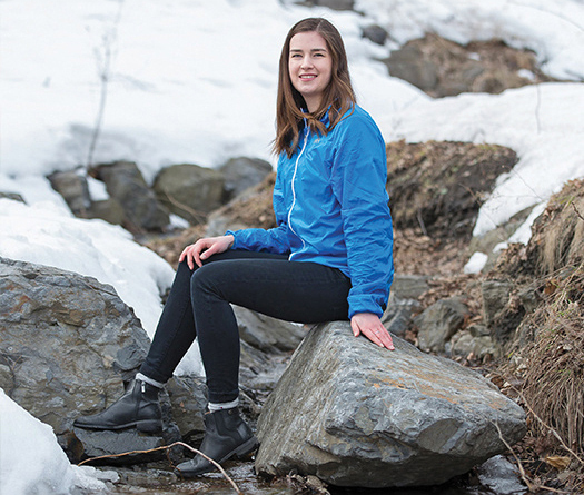 A person sitting on a rock