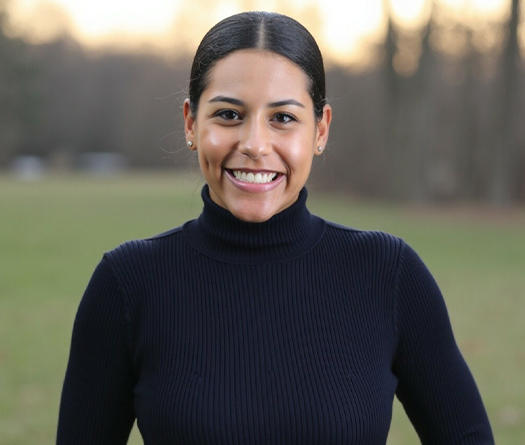 A woman smiling at the camera.