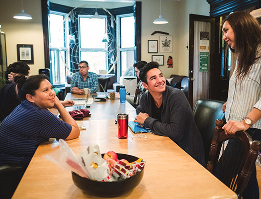 A group of people sitting around a table