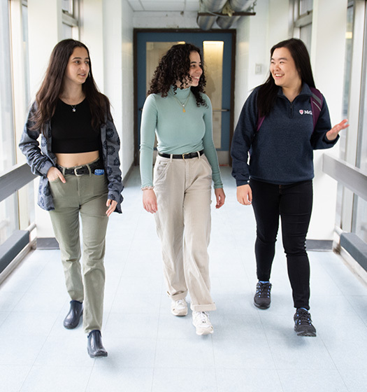 A group of women walking in a hallway