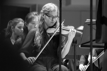 Photo of a student playing a violin
