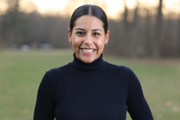 A woman smiling at the camera.