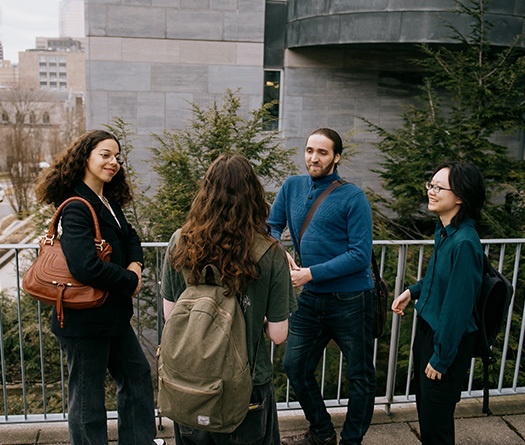 A group of people standing on a balcony