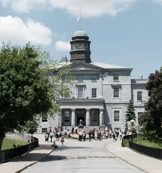 A group of people walking in front of a building