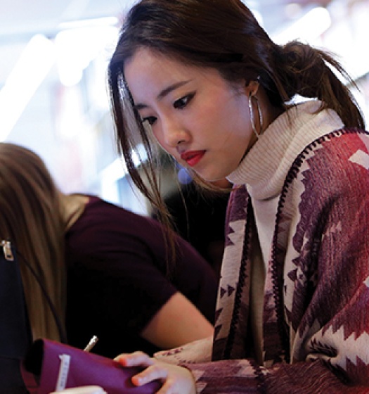 Photo of a student in the library