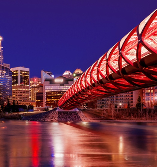 Bridge over water leading to a city