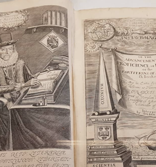 An old book with a picture of a person and a ship.