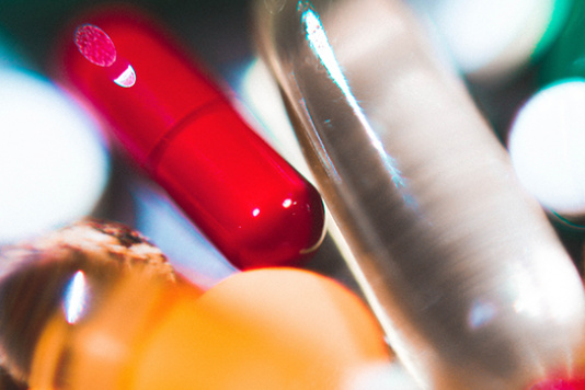 Blurry photo of red and white pill capsules